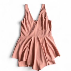 Pastel peach romper with slight ruffle hem